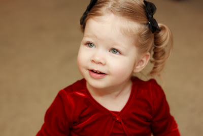 So pretty in her Christmas dress!